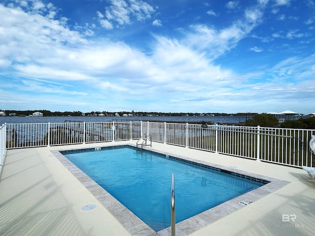 view of pool featuring a water view