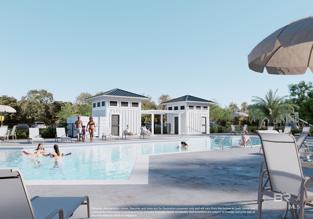 view of swimming pool featuring a patio and an outdoor structure