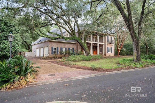 view of front of house with a balcony and a garage