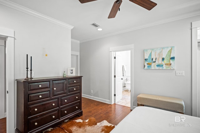 bedroom featuring crown molding, dark wood finished floors, a ceiling fan, visible vents, and baseboards