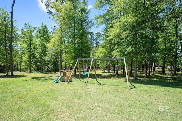 view of jungle gym with a lawn