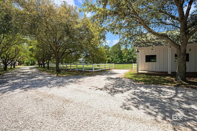 view of road featuring gravel driveway