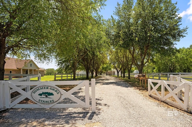 view of gate with fence