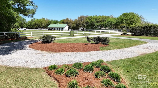 view of yard with a rural view and fence