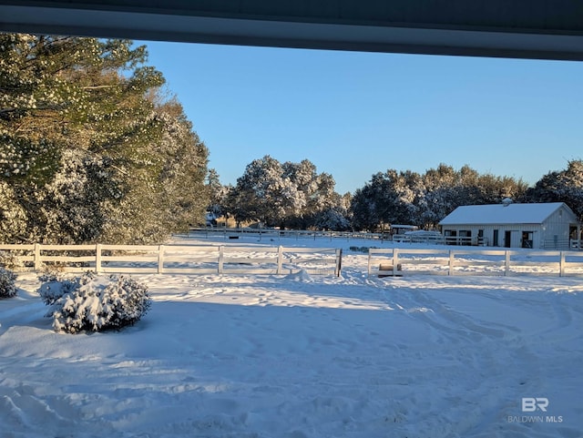 yard layered in snow with fence