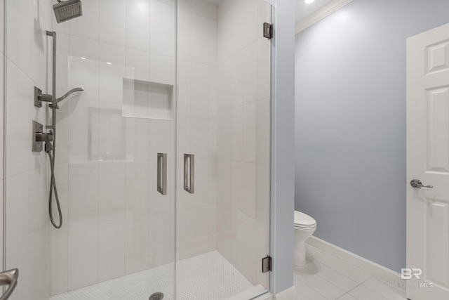 30595 Laurel Ct, Daphne, AL 36527 - bathroom with baseboards, tile patterned flooring, a stall shower, and toilet