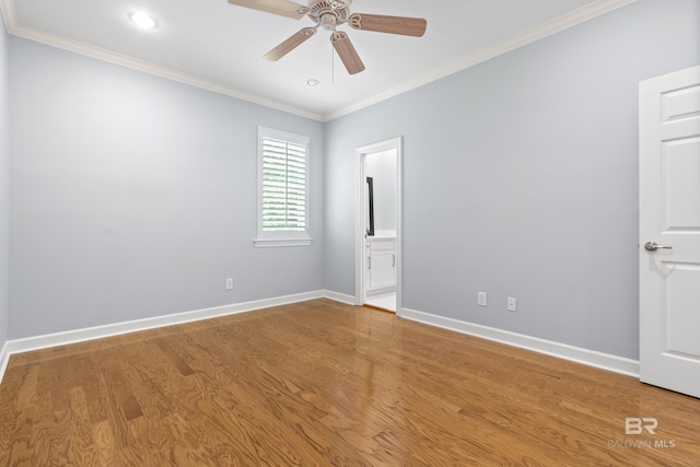 empty room with crown molding, baseboards, ceiling fan, recessed lighting, and light wood-style flooring