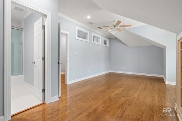 bonus room featuring visible vents, baseboards, ceiling fan, and wood finished floors