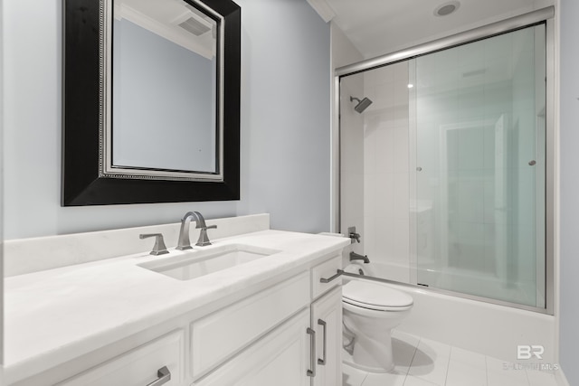 bathroom featuring vanity, visible vents, toilet, tile patterned floors, and enclosed tub / shower combo