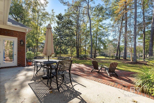 view of patio featuring outdoor dining area