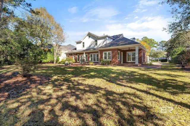 back of house featuring a yard