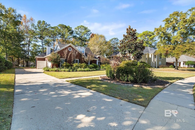 view of front of house with a garage, driveway, and a front yard