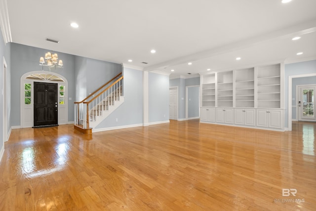 foyer with visible vents, an inviting chandelier, ornamental molding, recessed lighting, and light wood-type flooring