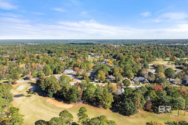birds eye view of property featuring a wooded view and golf course view