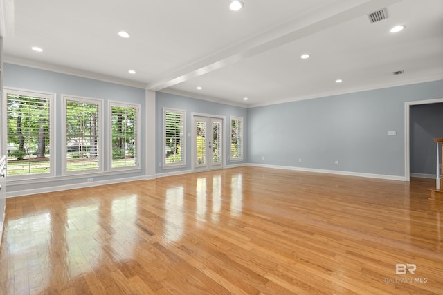 30595 Laurel Ct, Daphne, AL 36527 - unfurnished living room featuring crown molding, baseboards, a wealth of natural light, and light wood-type flooring