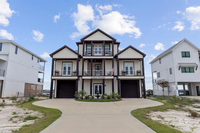 2282 W W Beach Blvd, Gulf Shores, AL 36542 - raised beach house with a balcony, french doors, a garage, and concrete driveway