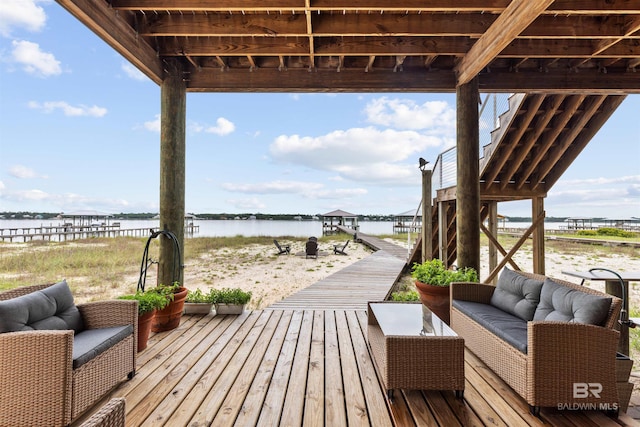 2282 W W Beach Blvd, Gulf Shores, AL 36542 - wooden deck with outdoor lounge area and a water view