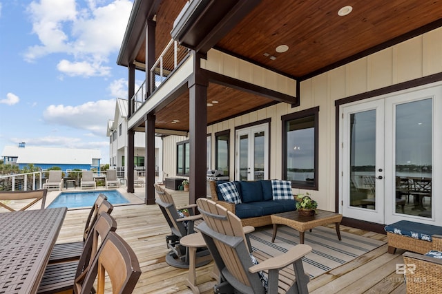 2282 W W Beach Blvd, Gulf Shores, AL 36542 - wooden deck with french doors and an outdoor living space
