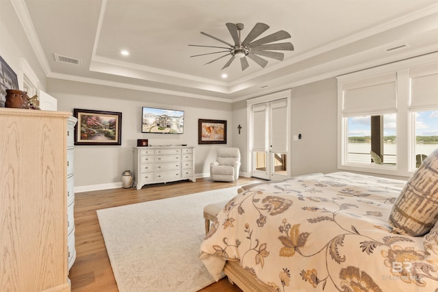 2282 W W Beach Blvd, Gulf Shores, AL 36542 - bedroom with a raised ceiling, light wood finished floors, recessed lighting, a ceiling fan, and ornamental molding