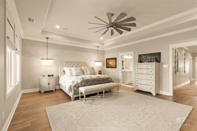 2282 W W Beach Blvd, Gulf Shores, AL 36542 - bedroom featuring light wood finished floors, a raised ceiling, ensuite bath, crown molding, and recessed lighting