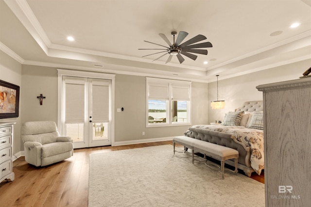 2282 W W Beach Blvd, Gulf Shores, AL 36542 - bedroom with a tray ceiling, light wood-type flooring, access to exterior, crown molding, and a ceiling fan