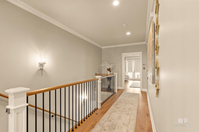 2282 W W Beach Blvd, Gulf Shores, AL 36542 - hallway with an upstairs landing, light wood-style floors, ornamental molding, and recessed lighting