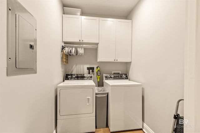 2282 W W Beach Blvd, Gulf Shores, AL 36542 - laundry room featuring cabinet space, electric panel, and separate washer and dryer