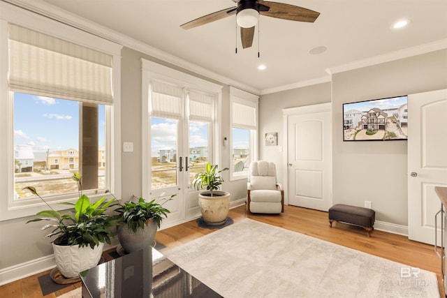 2282 W W Beach Blvd, Gulf Shores, AL 36542 - living area featuring crown molding, plenty of natural light, wood finished floors, ceiling fan, and recessed lighting