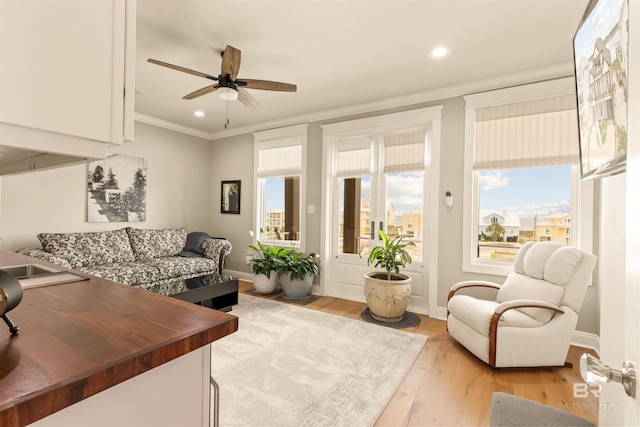 2282 W W Beach Blvd, Gulf Shores, AL 36542 - living room featuring ornamental molding, a ceiling fan, recessed lighting, and light wood-style flooring