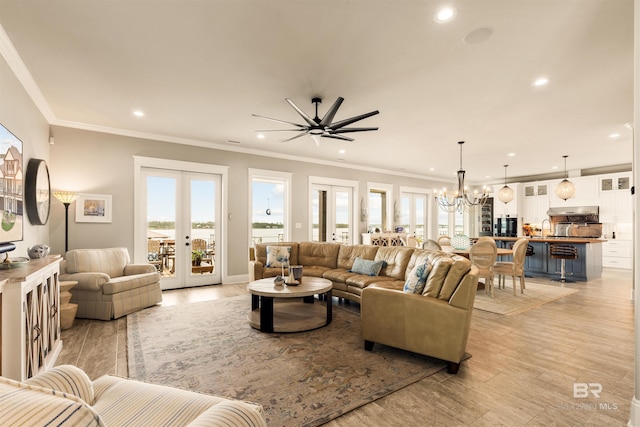2282 W W Beach Blvd, Gulf Shores, AL 36542 - living room featuring a chandelier, french doors, recessed lighting, crown molding, and light wood-style floors