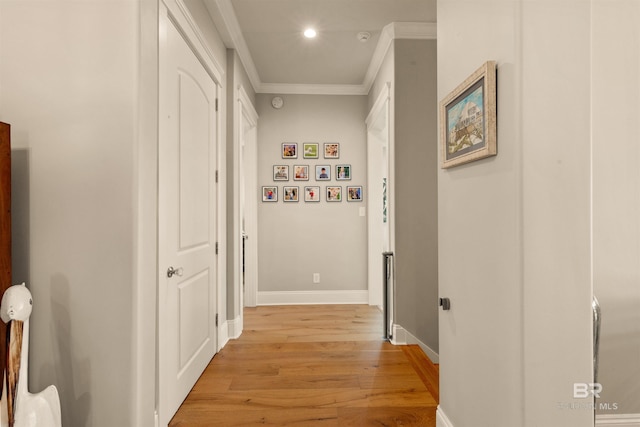 2282 W W Beach Blvd, Gulf Shores, AL 36542 - hallway with crown molding, light wood-style flooring, and recessed lighting