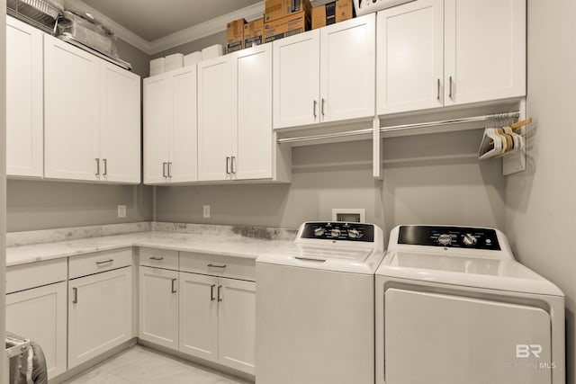 2282 W W Beach Blvd, Gulf Shores, AL 36542 - laundry area featuring cabinet space, independent washer and dryer, ornamental molding, and light marble finish flooring
