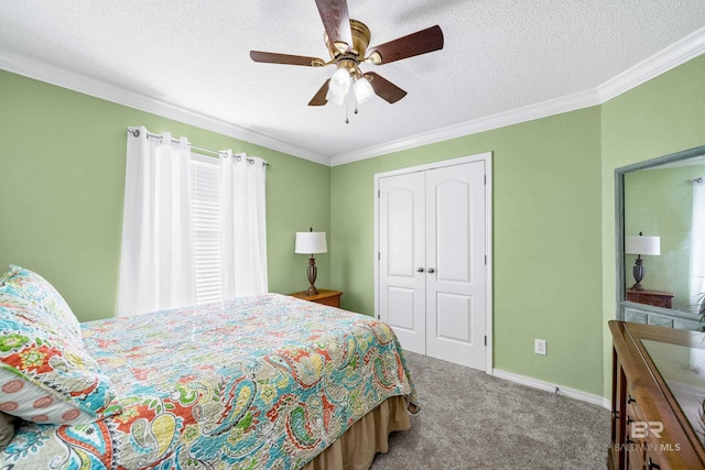 bedroom featuring carpet flooring, ceiling fan, crown molding, and a closet