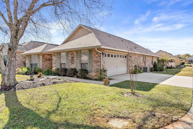 single story home with central AC unit, a front yard, and a garage