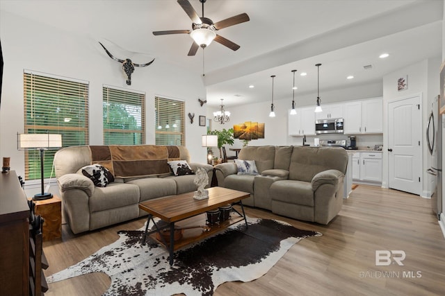 14437 Chenin Blanc Dr, Silverhill, AL 36576 - living area with recessed lighting, ceiling fan, plenty of natural light, light wood finished floors, and a chandelier