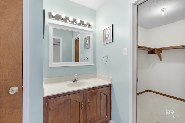 9215 Shiloh Dr, Mobile, AL 36695 - bathroom with vanity and a walk in closet