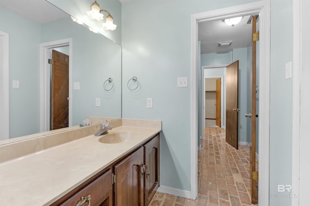 9215 Shiloh Dr, Mobile, AL 36695 - bathroom with brick patterned floors and vanity