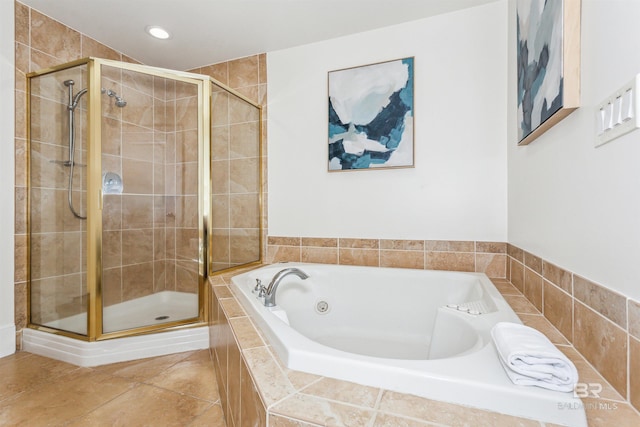 full bath featuring recessed lighting, a shower stall, a bath, and tile patterned floors