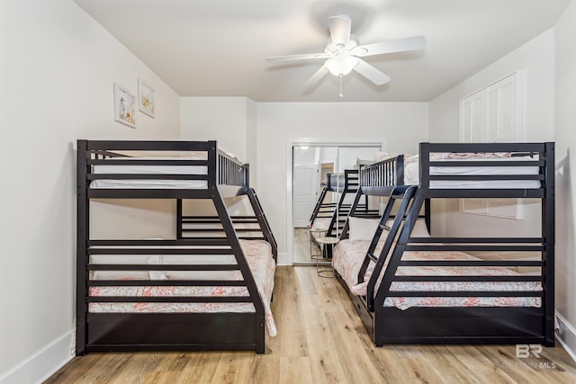 bedroom featuring baseboards and wood finished floors