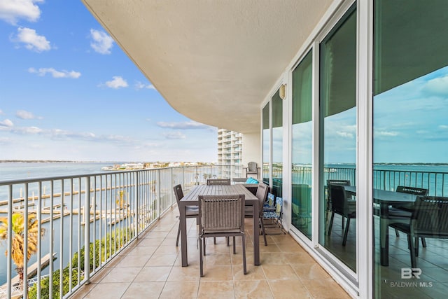 balcony featuring a water view