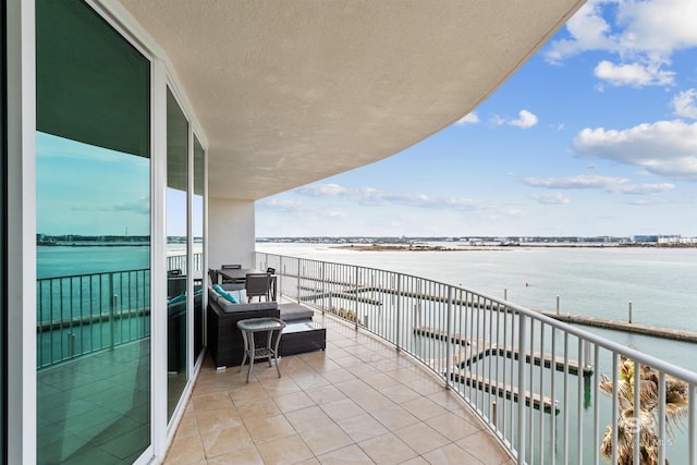 balcony featuring a water view