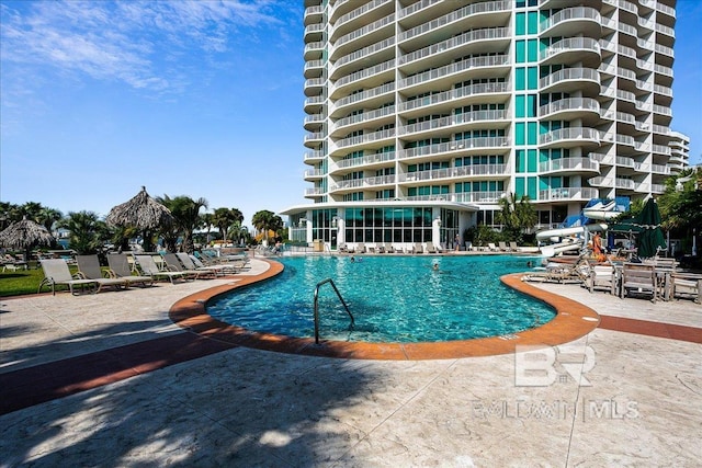 community pool with a patio area