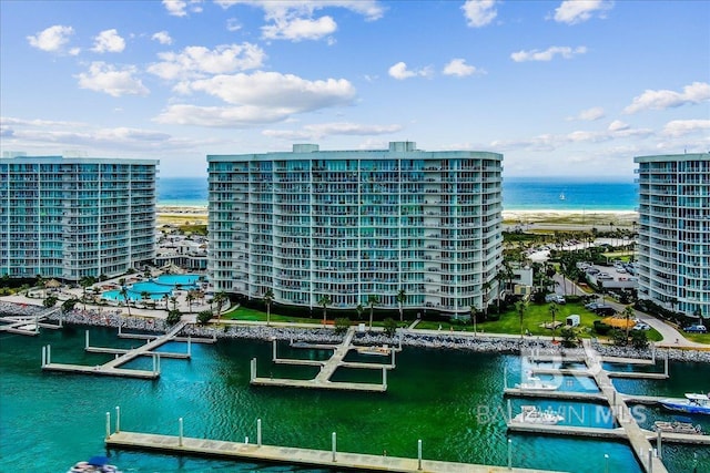 birds eye view of property with a water view and a city view