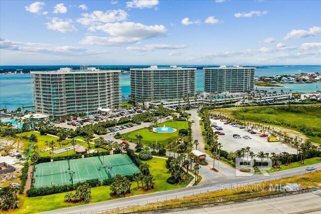 birds eye view of property featuring a view of city and a water view