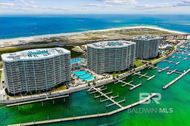 aerial view featuring a view of city and a water view