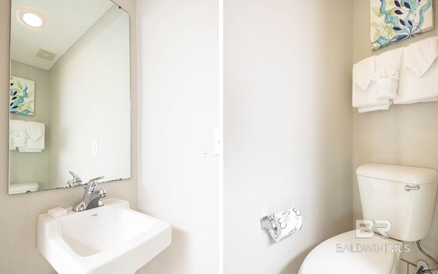 bathroom with sink and toilet