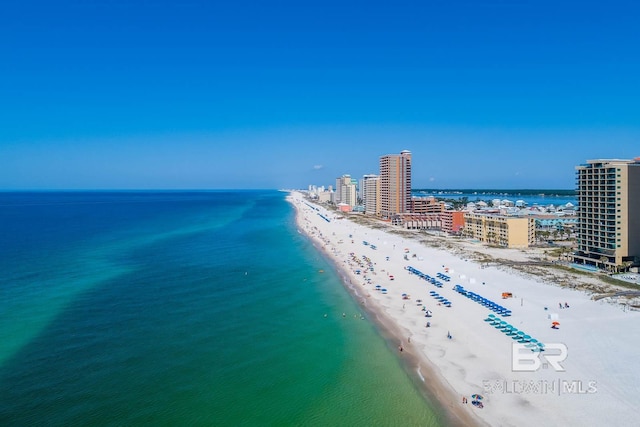 aerial view featuring a water view and a beach view