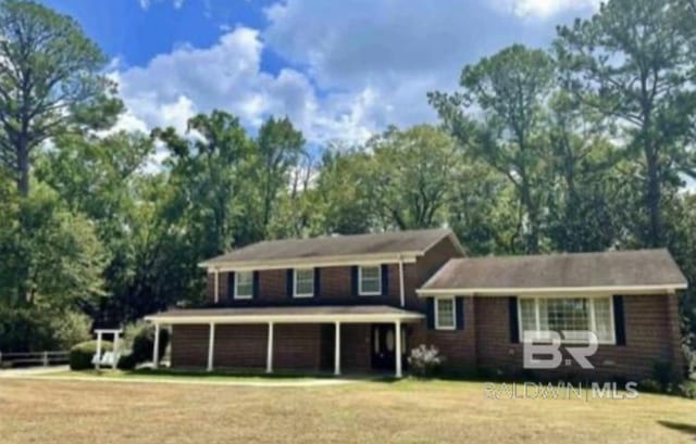 tri-level home with a front yard