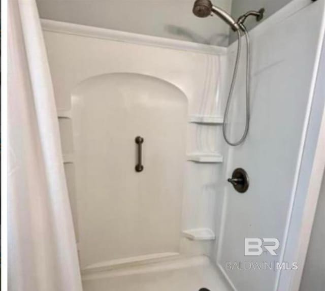 bathroom featuring walk in shower