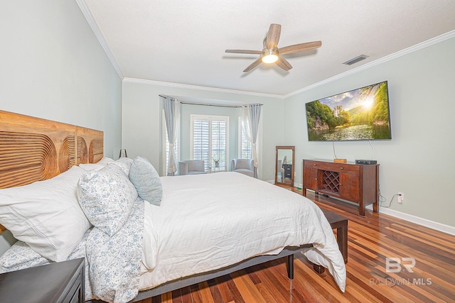 bedroom with ceiling fan, hardwood / wood-style flooring, and crown molding